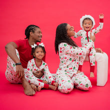 Load image into Gallery viewer, Family of four wearing matching Christmas pajamas against a red background