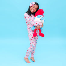Load image into Gallery viewer, Child in Smurfs official pajamas holding Smurf&#39;s  plush toy against a blue background