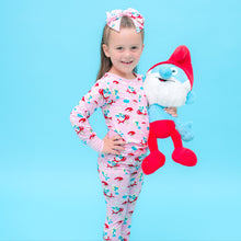 Load image into Gallery viewer, Child in pajamas holding smurfs plush toy wear smurfs official pajamas against a blue background